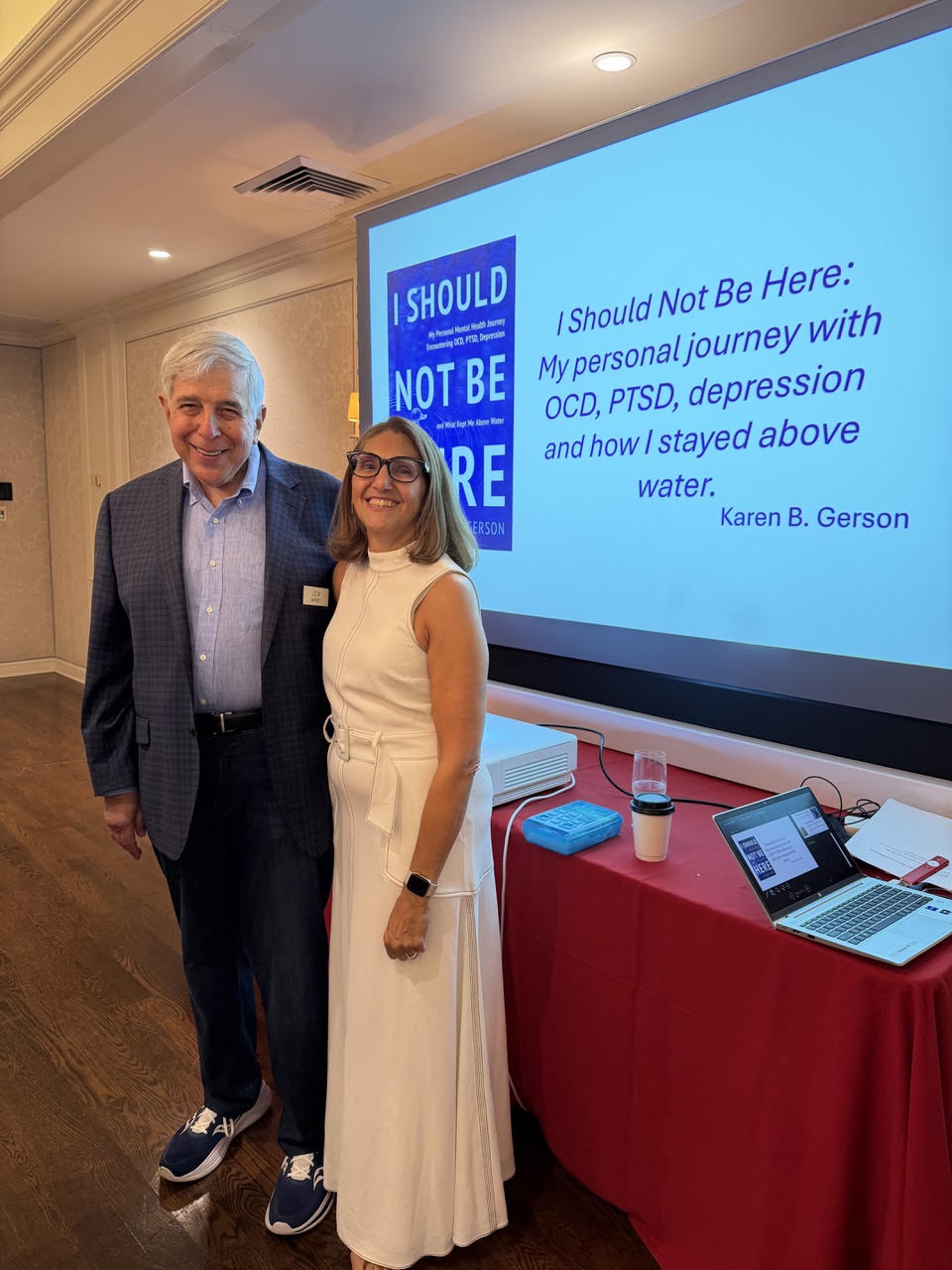 Lew Berey, Karen's mentor and Plaza Club member, and Karen B. Gerson in front of her I Should Not Be Here title slide