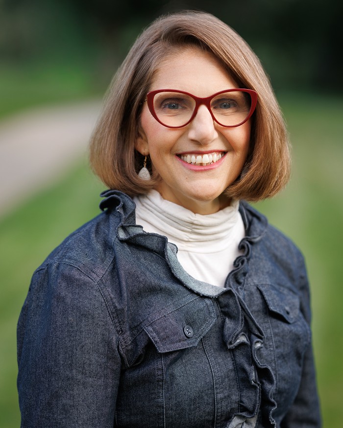Portrait of author Karen B. Gerson smiling outdoors
